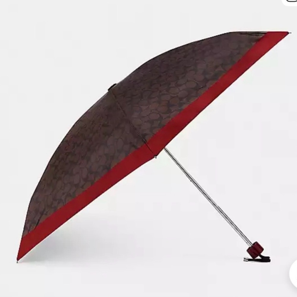 Coach Signature UV Protection Mini Umbrella
Chestnut with Fuchsia trim NWOT